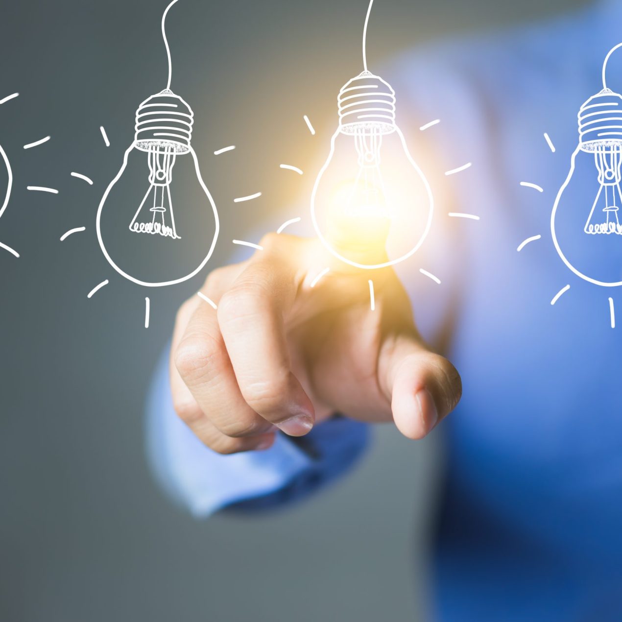 Businessman,Touching,Light,Bulbs,,New,Ideas,With,Innovative,Technology,And